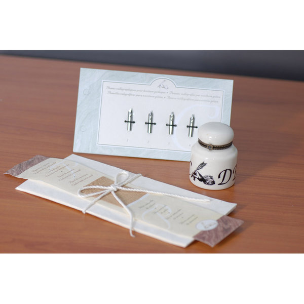 Calligraphy inkhorn, paper and nibs 